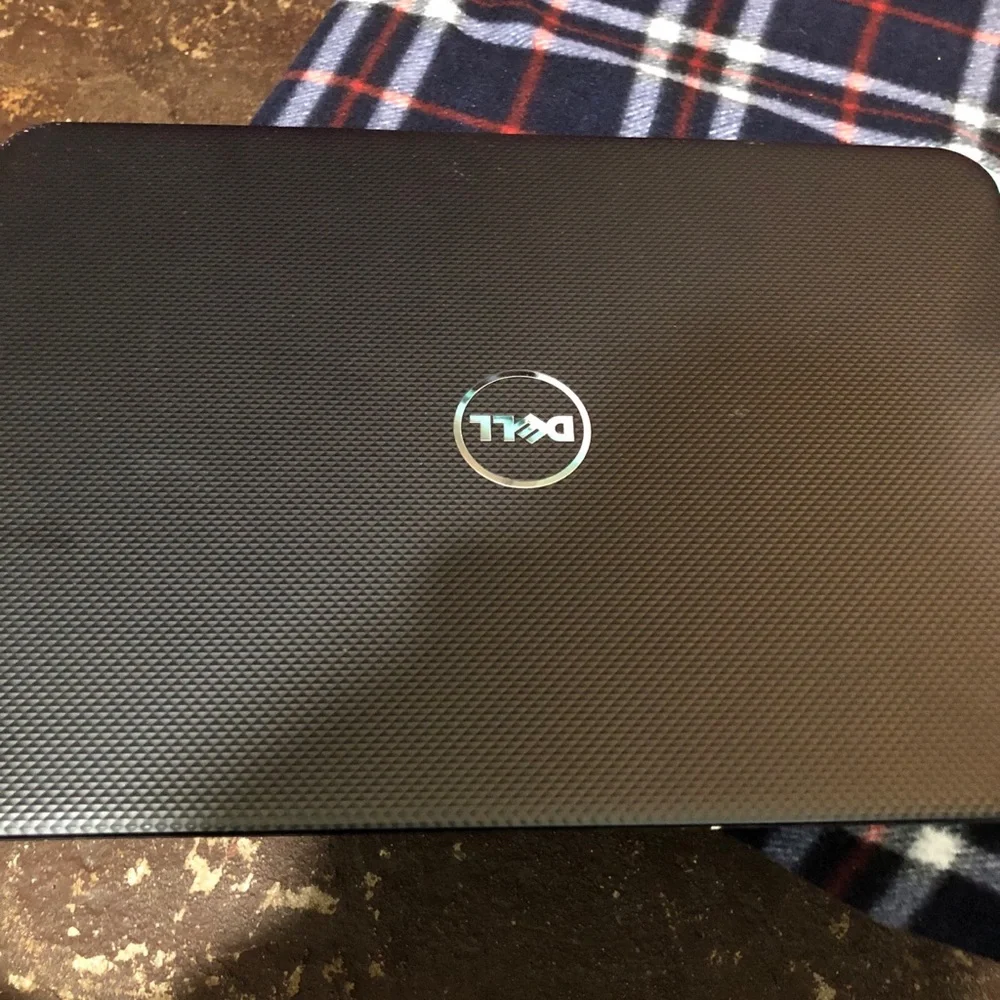 Apple MacBook with 4 chargers and dell laptop for parts